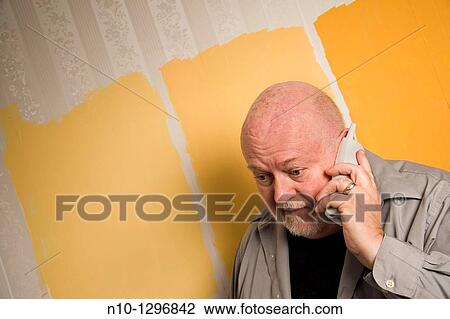 Balding, middle-age man talking on the telephone View Large Photo Image Stock Image - Balding, middle-age man talking on the telephone. Fotosearch
