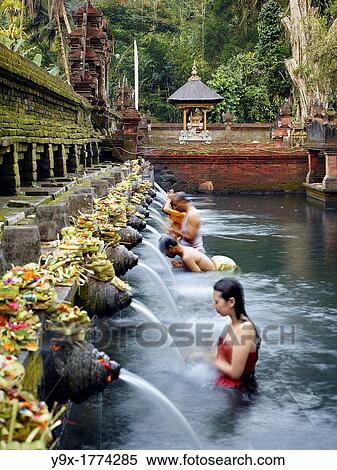 Balinese bath in the sacred waters of Tirta Empul An ancient natural water spring feeds the baths This area is believed to be the ancient center of the Subak culture View Large Photo Image Stock Photography - Balinese bath in the sacred waters of Tirta Empul An ancient natural water spring feeds the baths This area is believed to be the ancient center of the Subak culture. Fotosearch