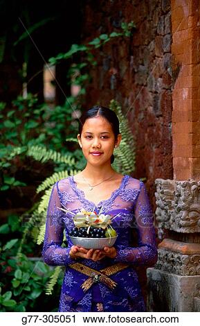 Balinese woman making offering to gods. Ubud, Indonesia View Large Photo Image Stock Image - Balinese woman making offering to gods. Ubud, Indonesia. Fotosearch