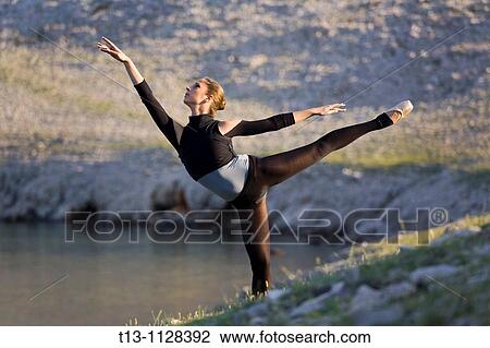 Ballerina dancing in a natural environment View Large Photo Image Stock Image - Ballerina dancing in a natural environment. Fotosearch