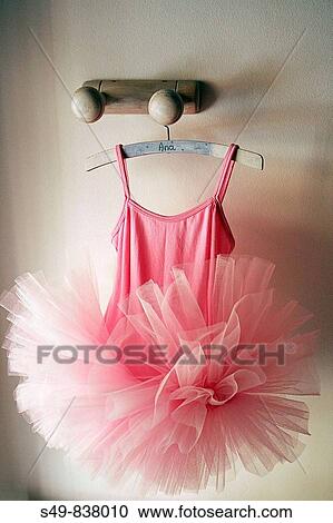 Stock Image - ballerina dress hanging from a perch. Fotosearch