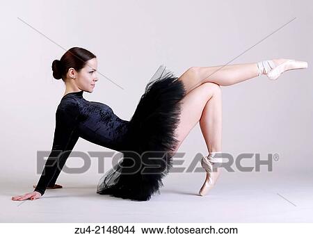 Picture - Ballerina posing in black tutu. Fotosearch