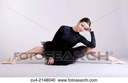Stock Image - Ballerina posing in black tutu. Fotosearch