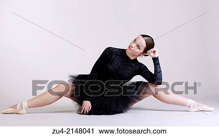 Ballerina posing in black tutu View Large Photo Image Stock Image - Ballerina posing in black tutu. Fotosearch