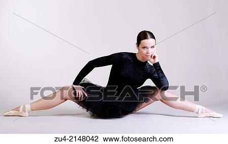 Stock Image - Ballerina posing in black tutu. Fotosearch