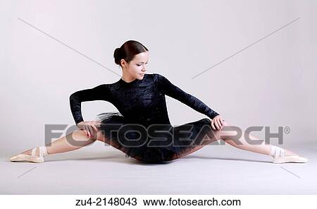 Ballerina posing in black tutu View Large Photo Image Stock Image - Ballerina posing in black tutu. Fotosearch