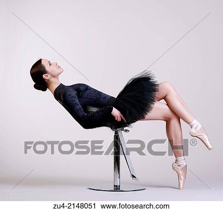 Ballerina posing in black tutu View Large Photo Image Stock Image - Ballerina posing in black tutu. Fotosearch