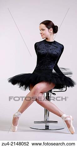 Ballerina posing in black tutu View Large Photo Image Stock Image - Ballerina posing in black tutu. Fotosearch