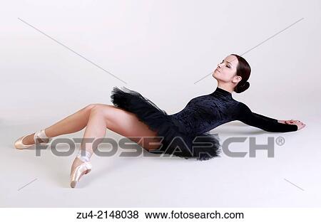 Stock Photo - Ballerina posing in black tutu. Fotosearch
