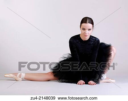 Stock Photo - Ballerina posing in black tutu. Fotosearch