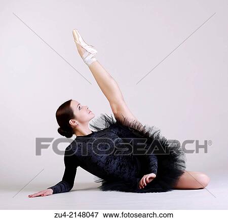 Ballerina posing in black tutu View Large Photo Image Stock Photo - Ballerina posing in black tutu. Fotosearch
