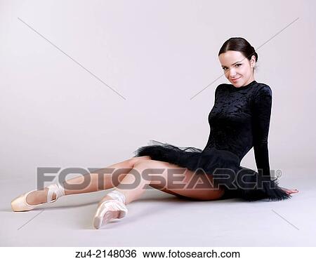 Ballerina posing in black tutu View Large Photo Image Stock Photograph - Ballerina posing in black tutu. Fotosearch