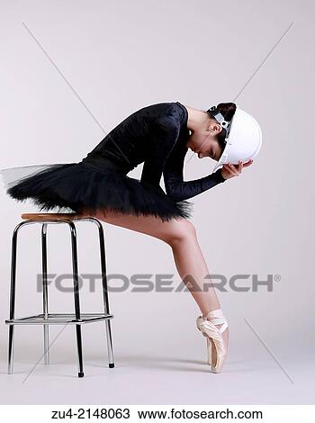 Ballerina posing in helmet View Large Photo Image Stock Image - Ballerina posing in helmet. Fotosearch