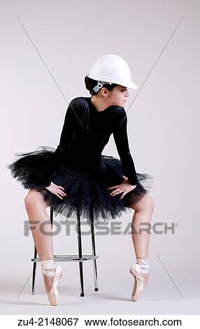 Stock Photo - Ballerina posing in helmet. Fotosearch
