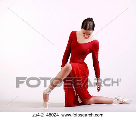 Ballerina posing in red dress View Large Photo Image Picture - Ballerina posing in red dress. Fotosearch