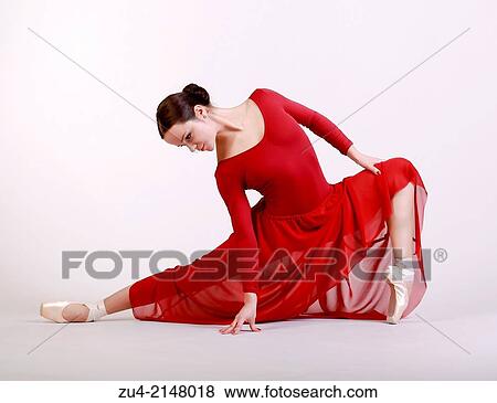Ballerina posing in red dress View Large Photo Image Stock Photo - Ballerina posing in red dress. Fotosearch