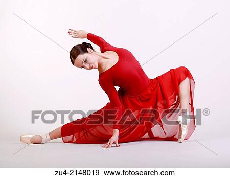 Stock Photo - Ballerina posing in red dress. Fotosearch