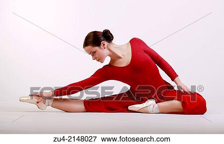 Ballerina posing in red dress View Large Photo Image Stock Photo - Ballerina posing in red dress. Fotosearch