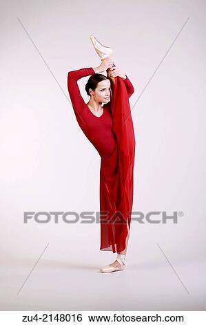 Stock Photograph - Ballerina posing in red dress. Fotosearch