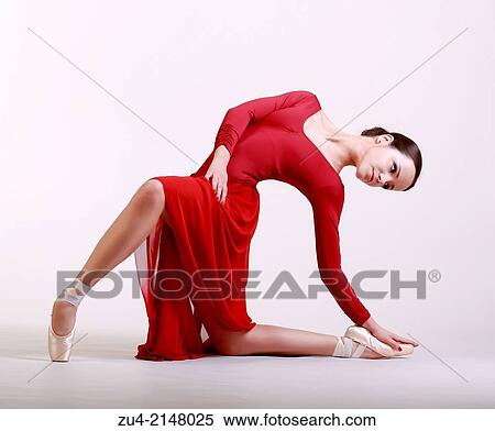 Stock Photography - Ballerina posing in red dress. Fotosearch