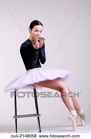 Stock Photo - Ballerina posing with food. Fotosearch