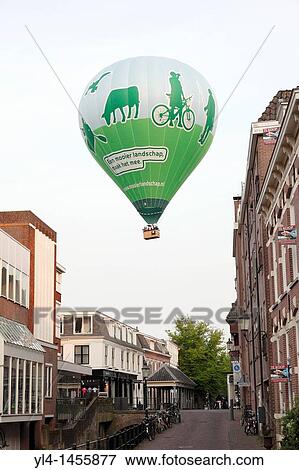 Balloon above the city of Amersfoort advertising for a nicer landscape, Netherlands View Large Photo Image Stock Photo - Balloon above the city of Amersfoort advertising for a nicer landscape, Netherlands. Fotosearch