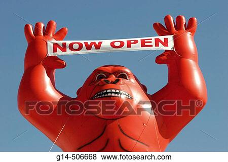 Stock Photo - Balloon, gorilla with sign, now open. Parrot Jungle. Watson Island. Miami. Florida. USA.. Fotosearch