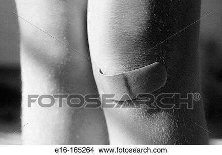 Band-aid on knee View Large Photo Image Picture - Band-aid on knee. Fotosearch