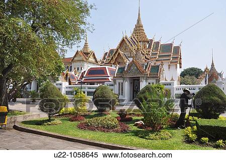Stock Photography - Bangkok (Thailand): a gardener working at the Royal Palace. Fotosearch