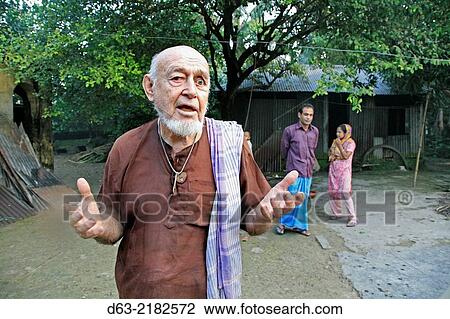 Stock Image - BANGLADESH. Americam Catholic missionary priest living in a village, Pouli.. Fotosearch