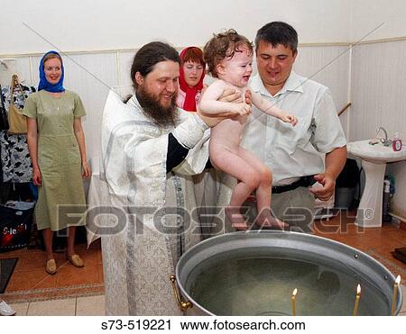 Baptism by the Orthodox rite in Togliatti, Samara Region, Russia View Large Photo Image Stock Image - Baptism by the Orthodox rite in Togliatti, Samara Region, Russia. Fotosearch