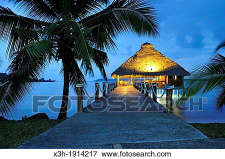 bar and restaurant on stilts at dusk, Playa Tortuga hotel, Colon Island, Bocas del Toro Archipelago, Republic of Panama, Central America View Large Photo Image Stock Photo - bar and restaurant on stilts at dusk, Playa Tortuga hotel, Colon Island, Bocas del Toro Archipelago, Republic of Panama, Central America. Fotosearch