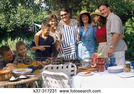 Barbecue with family, friends and neighbors in backyard View Large Photo Image Stock Image - Barbecue with family, friends and neighbors in backyard. Fotosearch