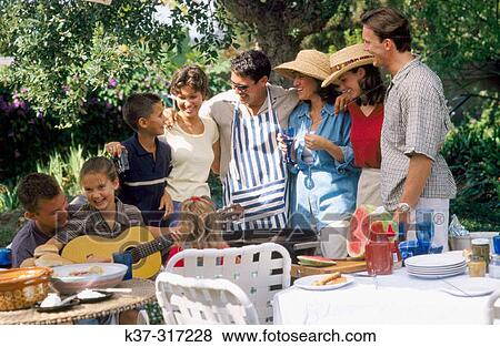 Barbecue with family, friends and neighbors in backyard View Large Photo Image Stock Photo - Barbecue with family, friends and neighbors in backyard. Fotosearch