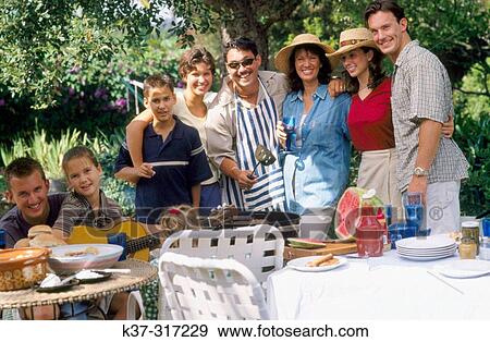 Barbecue with family, friends and neighbors in backyard View Large Photo Image Stock Photo - Barbecue with family, friends and neighbors in backyard. Fotosearch