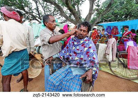 Barber giving man a haircut. Ashavihar tribal market, Bokaro, Jharkhand, India. View Large Photo Image Stock Image - Barber giving man a haircut. Ashavihar tribal market, Bokaro, Jharkhand, India.. Fotosearch