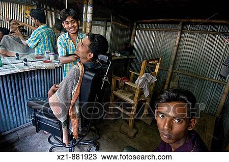 Stock Image - Barber's shop, Jessore district, Bangladesh. Fotosearch