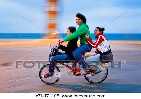 Barcelona: Friends riding bike in Passeig Maritim de la Barceloneta View Large Photo Image Stock Photography - Barcelona: Friends riding bike in Passeig Maritim de la Barceloneta. Fotosearch