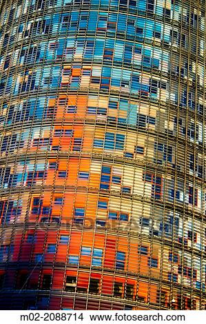 Picture - BARCELONA, SPAIN: Torre Agbar in the Poblenou neighborhood in Barcelona, Spain. Owned by the Agbar Group, it is a 38-story skyscraper / tower and a famous landmark of the city.. Fotosearch