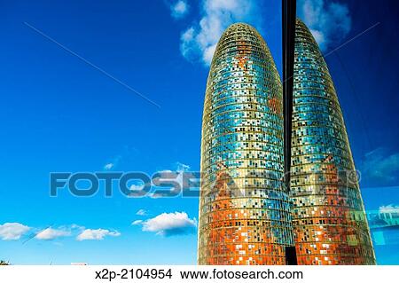 BARCELONA, SPAIN: Torre Agbar in the Poblenou neighborhood in Barcelona, Spain. Owned by the Agbar Group, it is a 38-story skyscraper / tower and a famous landmark of the city. View Large Photo Image Picture - BARCELONA, SPAIN: Torre Agbar in the Poblenou neighborhood in Barcelona, Spain. Owned by the Agbar Group, it is a 38-story skyscraper / tower and a famous landmark of the city.. Fotosearch