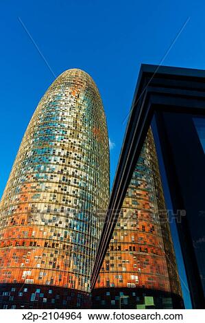 BARCELONA, SPAIN: Torre Agbar in the Poblenou neighborhood in Barcelona, Spain. Owned by the Agbar Group, it is a 38-story skyscraper / tower and a famous landmark of the city. View Large Photo Image Picture - BARCELONA, SPAIN: Torre Agbar in the Poblenou neighborhood in Barcelona, Spain. Owned by the Agbar Group, it is a 38-story skyscraper / tower and a famous landmark of the city.. Fotosearch