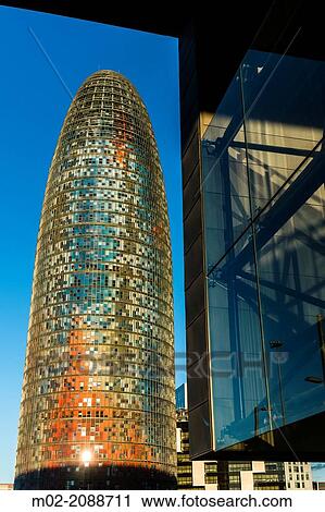 BARCELONA, SPAIN: Torre Agbar in the Poblenou neighborhood in Barcelona, Spain. Owned by the Agbar Group, it is a 38-story skyscraper / tower and a famous landmark of the city. View Large Photo Image Stock Image - BARCELONA, SPAIN: Torre Agbar in the Poblenou neighborhood in Barcelona, Spain. Owned by the Agbar Group, it is a 38-story skyscraper / tower and a famous landmark of the city.. Fotosearch