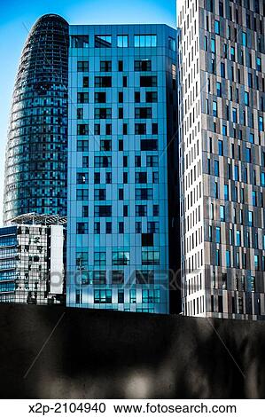 BARCELONA, SPAIN: Torre Agbar in the Poblenou neighborhood in Barcelona, Spain. Owned by the Agbar Group, it is a 38-story skyscraper / tower and a famous landmark of the city. View Large Photo Image Stock Image - BARCELONA, SPAIN: Torre Agbar in the Poblenou neighborhood in Barcelona, Spain. Owned by the Agbar Group, it is a 38-story skyscraper / tower and a famous landmark of the city.. Fotosearch