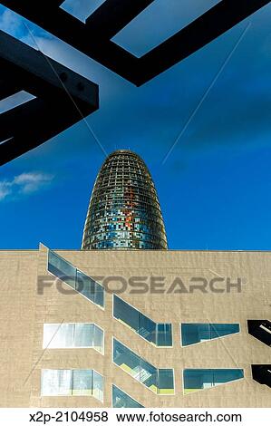 BARCELONA, SPAIN: Torre Agbar in the Poblenou neighborhood in Barcelona, Spain. Owned by the Agbar Group, it is a 38-story skyscraper / tower and a famous landmark of the city. View Large Photo Image Stock Photo - BARCELONA, SPAIN: Torre Agbar in the Poblenou neighborhood in Barcelona, Spain. Owned by the Agbar Group, it is a 38-story skyscraper / tower and a famous landmark of the city.. Fotosearch