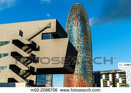 BARCELONA, SPAIN: Torre Agbar in the Poblenou neighborhood in Barcelona, Spain. Owned by the Agbar Group, it is a 38-story skyscraper / tower and a famous landmark of the city. View Large Photo Image Stock Photograph - BARCELONA, SPAIN: Torre Agbar in the Poblenou neighborhood in Barcelona, Spain. Owned by the Agbar Group, it is a 38-story skyscraper / tower and a famous landmark of the city.. Fotosearch
