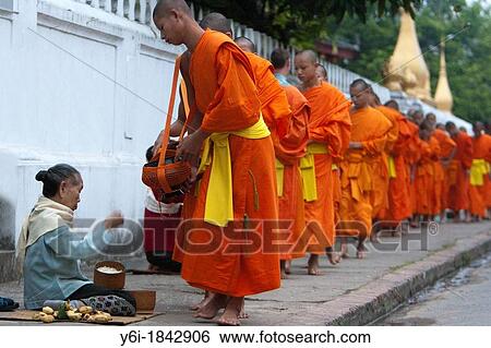 Barefoot monks collecting food and drink alms early morning Luang Prabang Laos View Large Photo Image Stock Photograph - Barefoot monks collecting food and drink alms early morning Luang Prabang Laos. Fotosearch