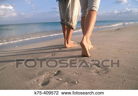 Barefoot prints on the beach View Large Photo Image Stock Image - Barefoot prints on the beach. Fotosearch