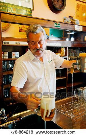 Barman puring beer at Plezenska Pivnice Beer Hall, Nove Mesto, Prague, Czech Republic View Large Photo Image Stock Photo - Barman puring beer at Plezenska Pivnice Beer Hall, Nove Mesto, Prague, Czech Republic. Fotosearch