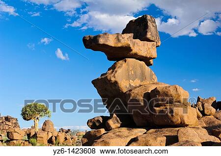 Stock Photo - Basalt rocks and Quiver Tree at Giants Playground near Keetmanshoop, Namibia. Fotosearch