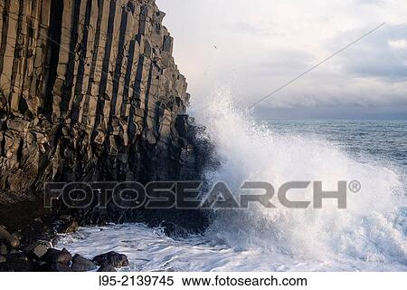 Basaltic lava flow solidified forming columns in the beaches of Vik, Iceland. View Large Photo Image Stock Photography - Basaltic lava flow solidified forming columns in the beaches of Vik, Iceland.. Fotosearch